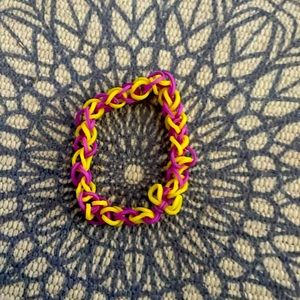 Purple and yellow rubber band bracelet